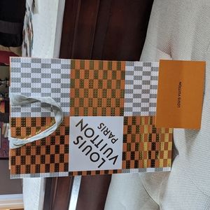 Louis Vuitton shopping bag.